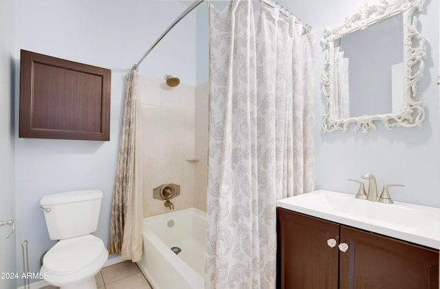 full bathroom with vanity, shower / tub combo with curtain, tile patterned flooring, and toilet