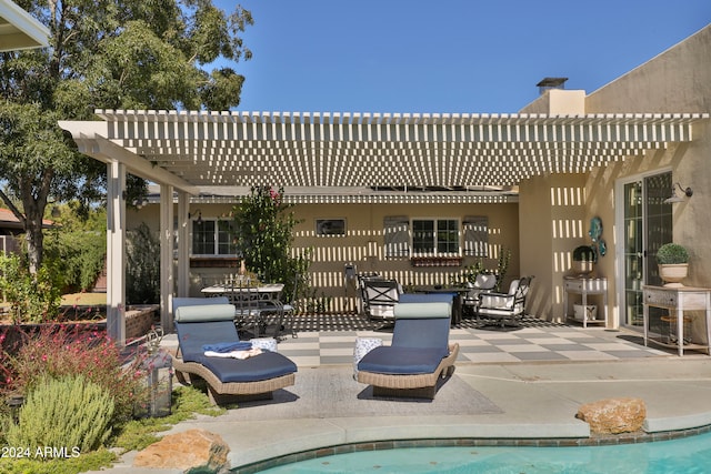 view of pool with a patio and a pergola