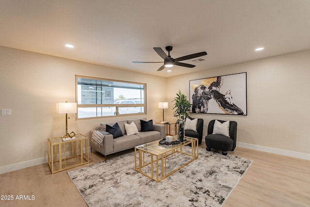 living area featuring ceiling fan, baseboards, wood finished floors, and recessed lighting