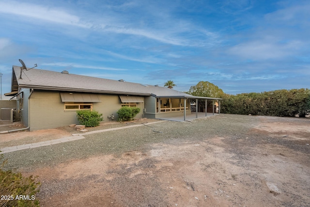 view of front of home with a shingled roof