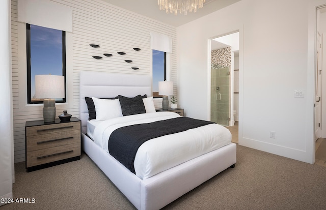 bedroom featuring carpet flooring and connected bathroom