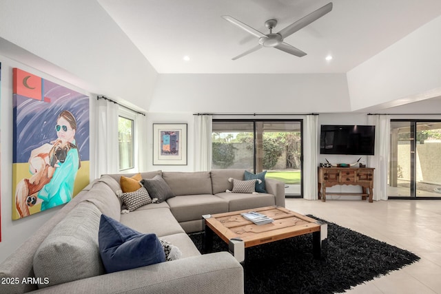 living room with tile patterned flooring, a ceiling fan, and recessed lighting