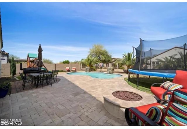 514 E Pearce Rd, Phoenix, AZ 85042 - view of swimming pool with a patio, a trampoline, and a fenced backyard