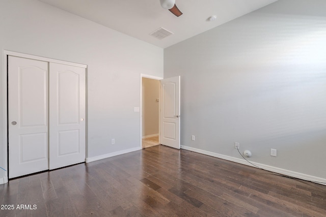 514 E Pearce Rd, Phoenix, AZ 85042 - unfurnished bedroom with wood finished floors, a closet, baseboards, and a ceiling fan