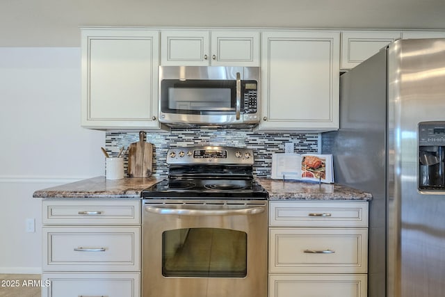 kitchen featuring appliances with stainless steel finishes, stone countertops, backsplash, and white cabinets