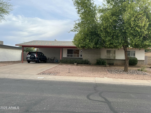 892 W Dublin St, Chandler, AZ 85225 - view of front of home with brick siding, driveway, and an attached carport
