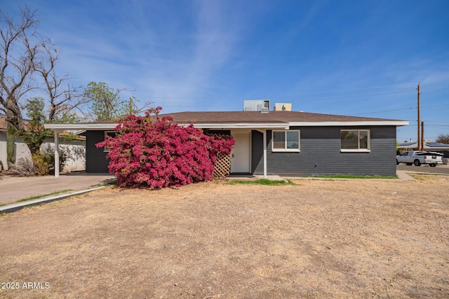 ranch-style house with an attached carport
