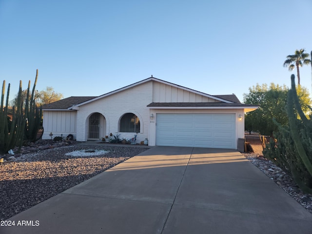 single story home featuring a garage