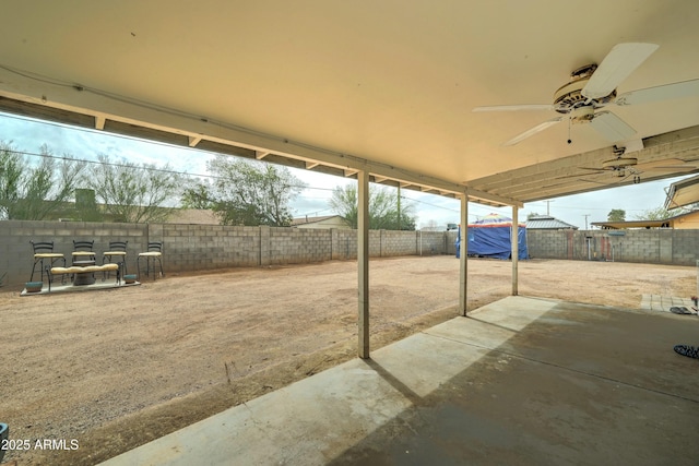 view of patio / terrace featuring a fenced backyard and a ceiling fan