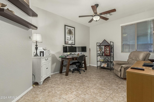 office space featuring ceiling fan and light tile patterned floors