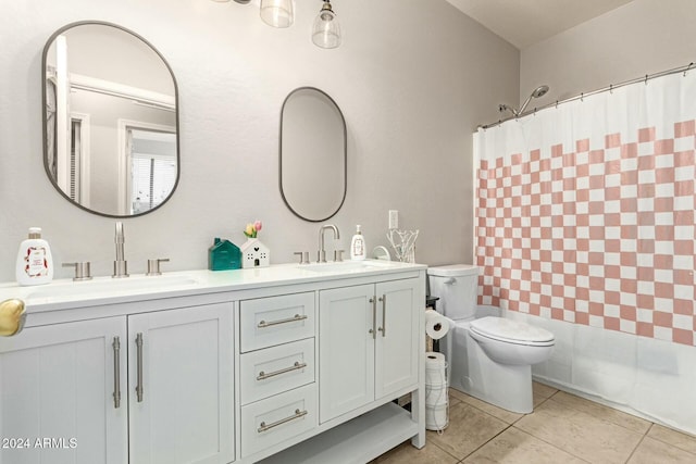 bathroom with tile patterned floors, vanity, and toilet