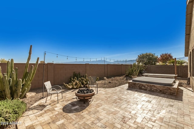 view of patio / terrace with an outdoor fire pit