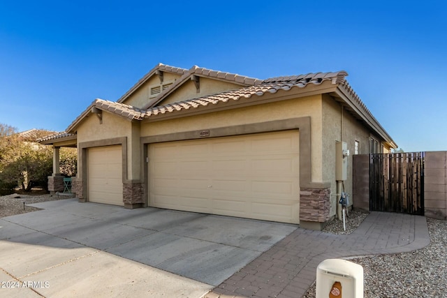 view of side of property with a garage