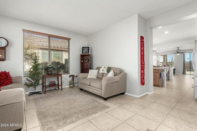 tiled living room featuring ceiling fan