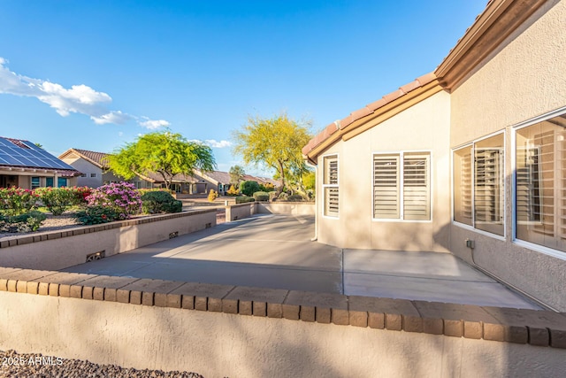 view of swimming pool featuring a residential view and a patio area