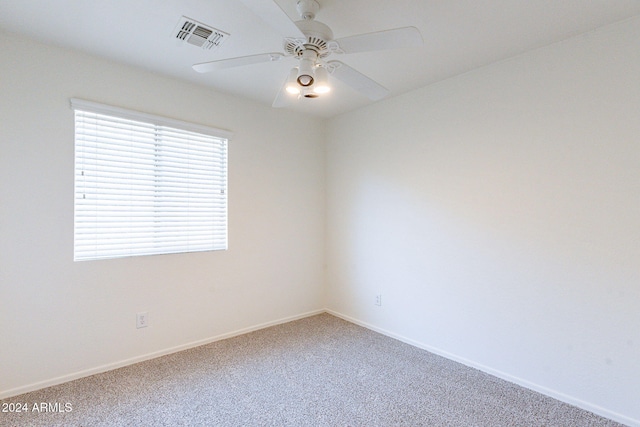 carpeted empty room with ceiling fan