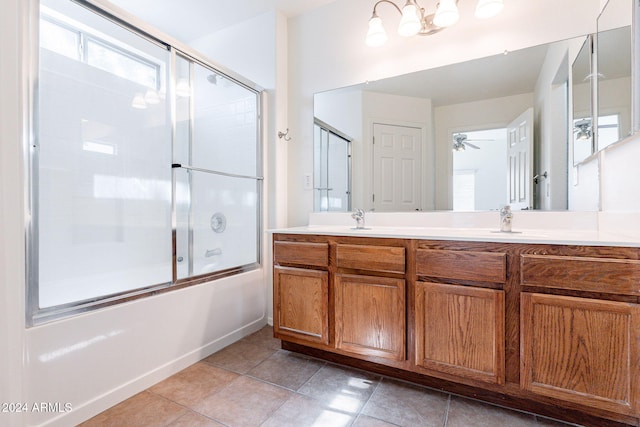 bathroom featuring vanity, bath / shower combo with glass door, tile patterned flooring, and ceiling fan