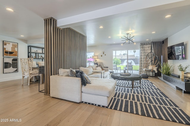 living area with recessed lighting and wood finished floors