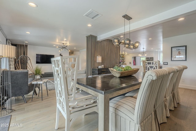 dining area featuring recessed lighting, light wood-style floors, and visible vents