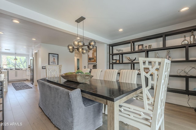 dining room featuring recessed lighting and wood finished floors