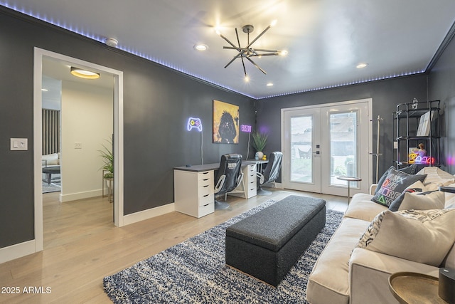 living area with light wood finished floors, recessed lighting, french doors, and baseboards
