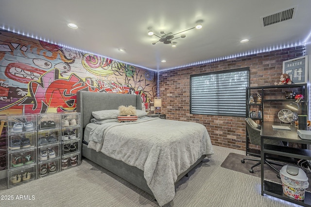 carpeted bedroom featuring recessed lighting, visible vents, and brick wall
