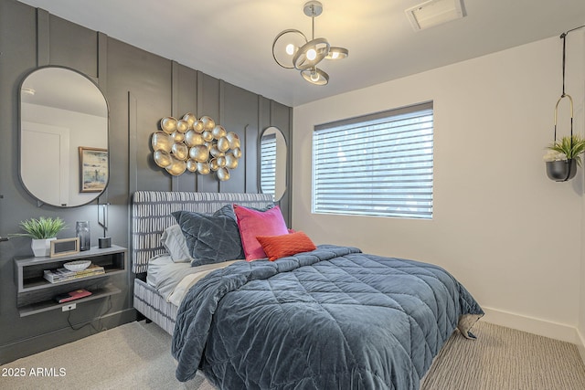 carpeted bedroom with baseboards and visible vents