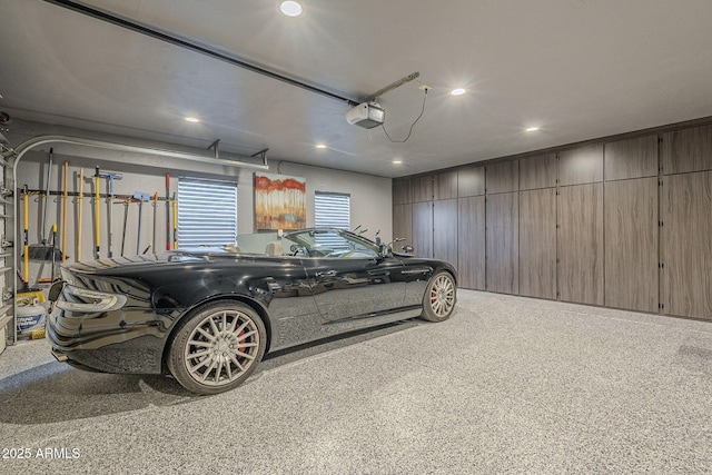 garage featuring recessed lighting and a garage door opener