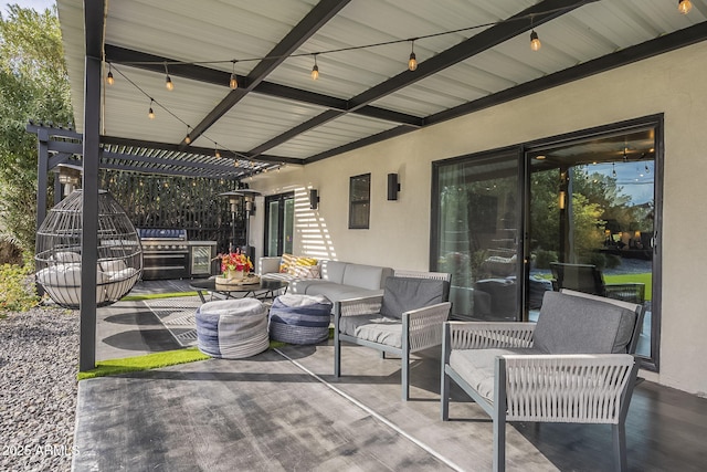 view of patio / terrace with area for grilling, a pergola, and an outdoor hangout area