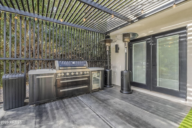 view of patio with a pergola and an outdoor kitchen