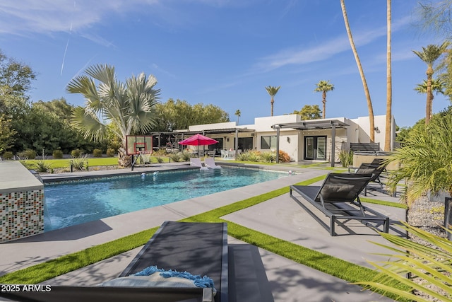 pool with a patio area