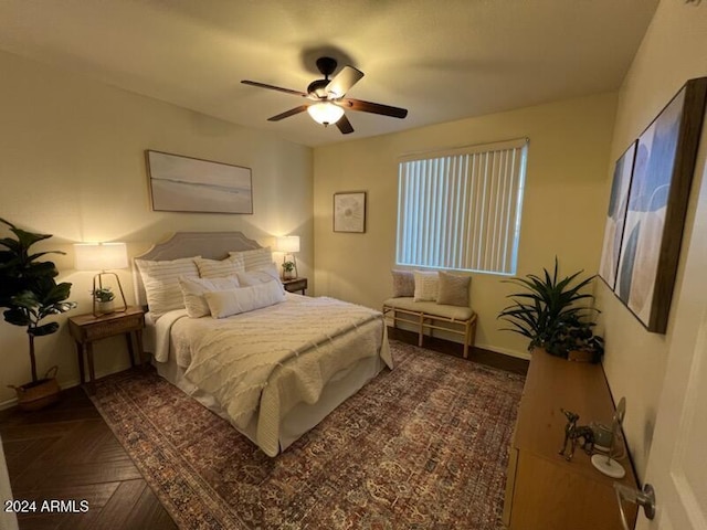 bedroom featuring dark parquet floors and ceiling fan