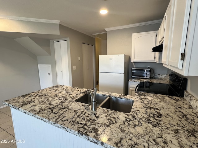 2301 E University Dr Unit 269, Mesa, AZ 85213 - kitchen featuring electric stove, freestanding refrigerator, stainless steel microwave, light stone countertops, and a peninsula