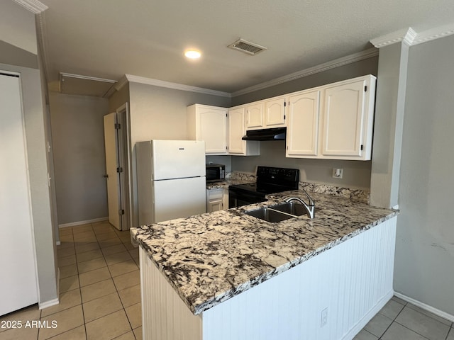 2301 E University Dr Unit 269, Mesa, AZ 85213 - kitchen featuring freestanding refrigerator, black range with electric cooktop, under cabinet range hood, light tile patterned floors, and a peninsula