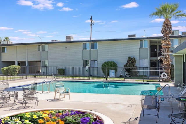 view of pool featuring a patio area