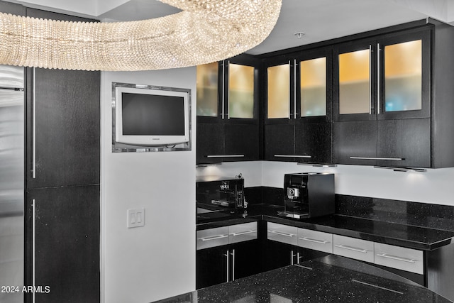 kitchen with dark stone countertops