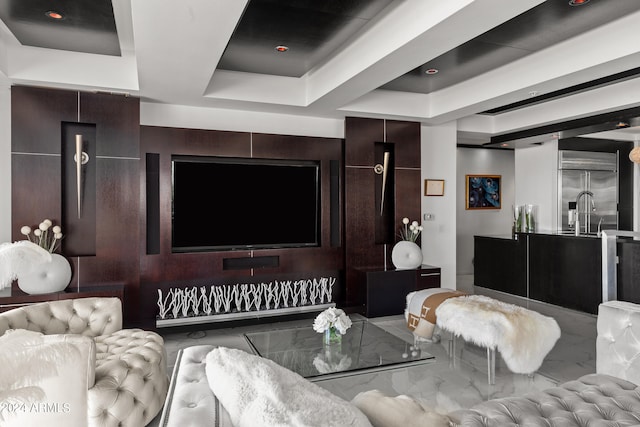 living room featuring a tray ceiling