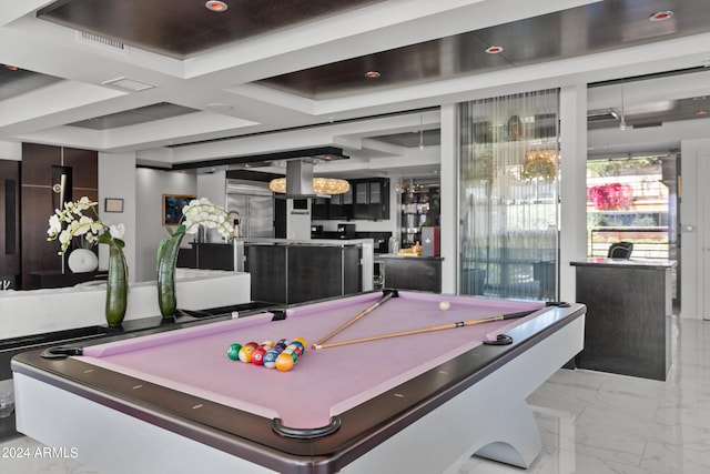 game room featuring light tile flooring, a raised ceiling, and pool table