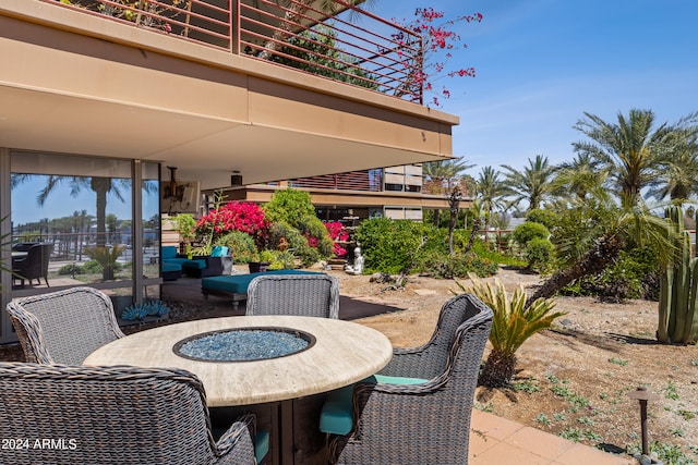 view of patio with a fire pit