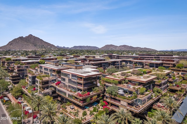 birds eye view of property featuring a mountain view