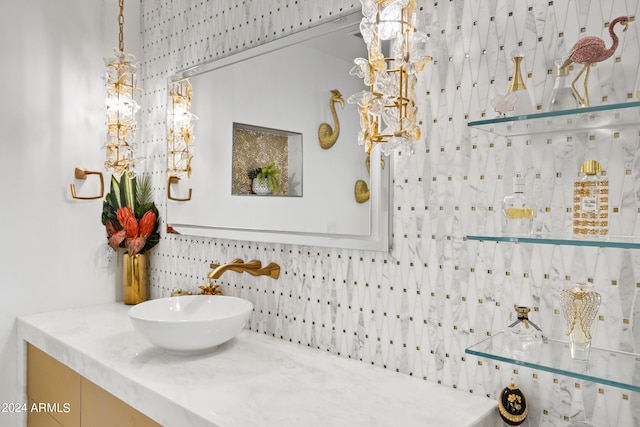 bathroom with vanity, tasteful backsplash, and tile walls