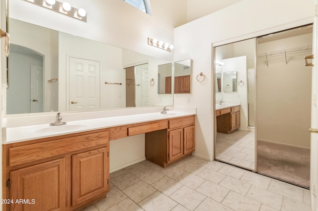 bathroom with tile patterned flooring and vanity