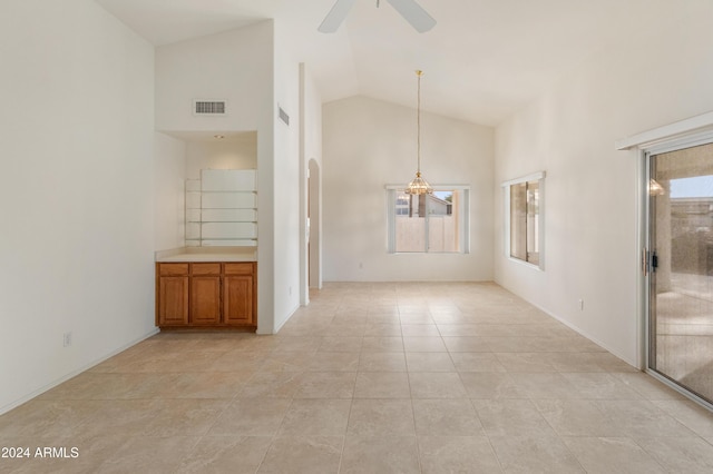 14543 W Bison Path, Surprise, AZ 85374 - unfurnished living room with high vaulted ceiling, a ceiling fan, a chandelier, and light tile patterned flooring