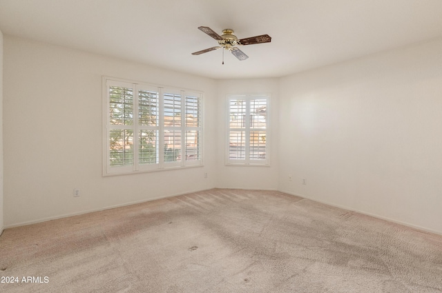 carpeted empty room with ceiling fan