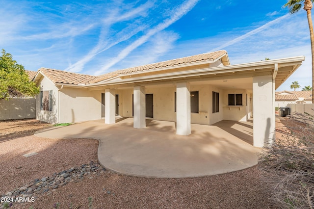 14543 W Bison Path, Surprise, AZ 85374 - rear view of house with stucco siding, a patio, and a tile roof