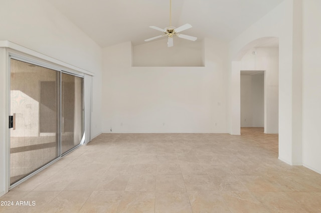 unfurnished room featuring light tile patterned floors, ceiling fan, and lofted ceiling