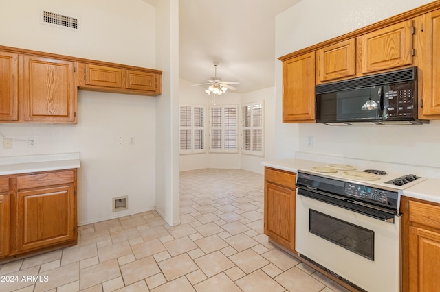 kitchen featuring ceiling fan and electric stove