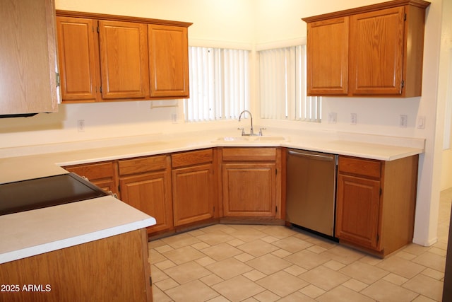14543 W Bison Path, Surprise, AZ 85374 - kitchen with stainless steel dishwasher, brown cabinetry, and light countertops