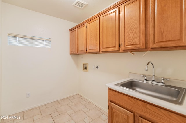 laundry room featuring cabinets, washer hookup, electric dryer hookup, and sink