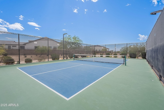 view of sport court with fence and community basketball court